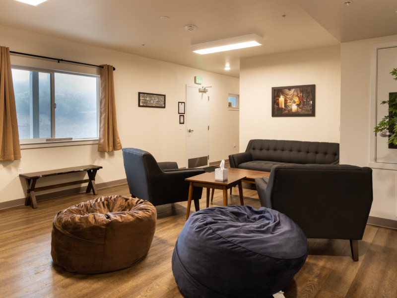 Disciples Lodge gathering space with seating and window