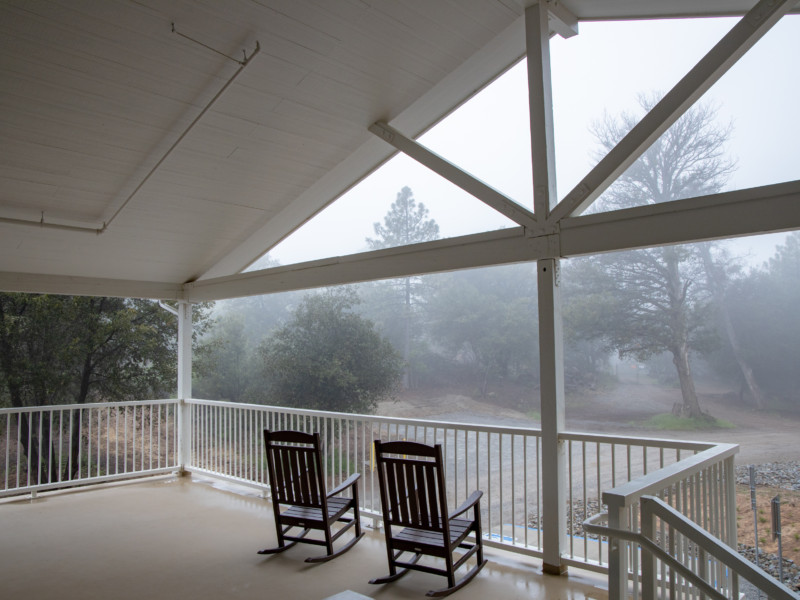 Upper Disciples Lodge covered patio with rocking chairs