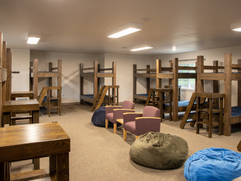 Upper level wing of Disciples Lodge with seating and bunkbeds
