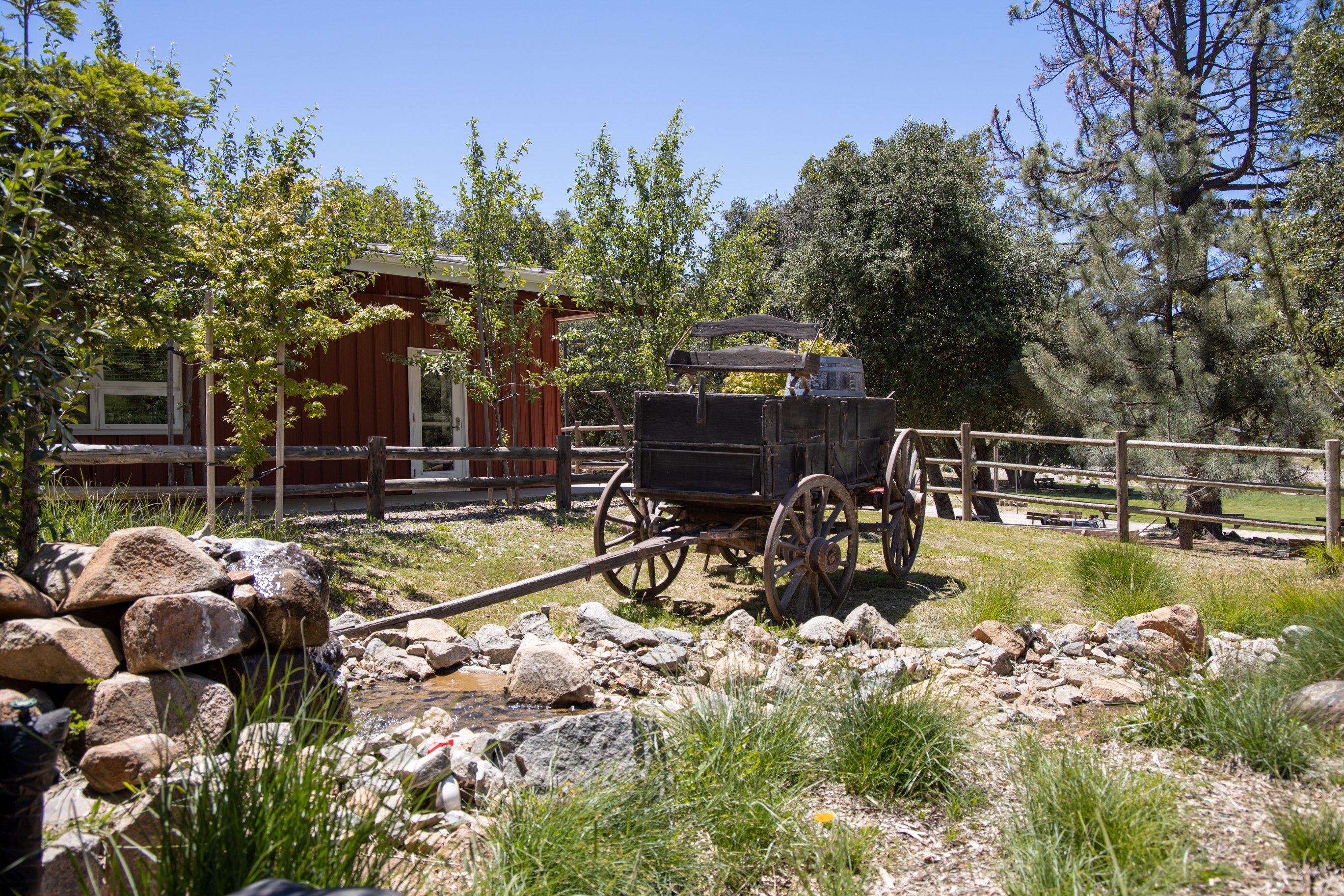 Vintage wagon near stream in front of Dining Hall