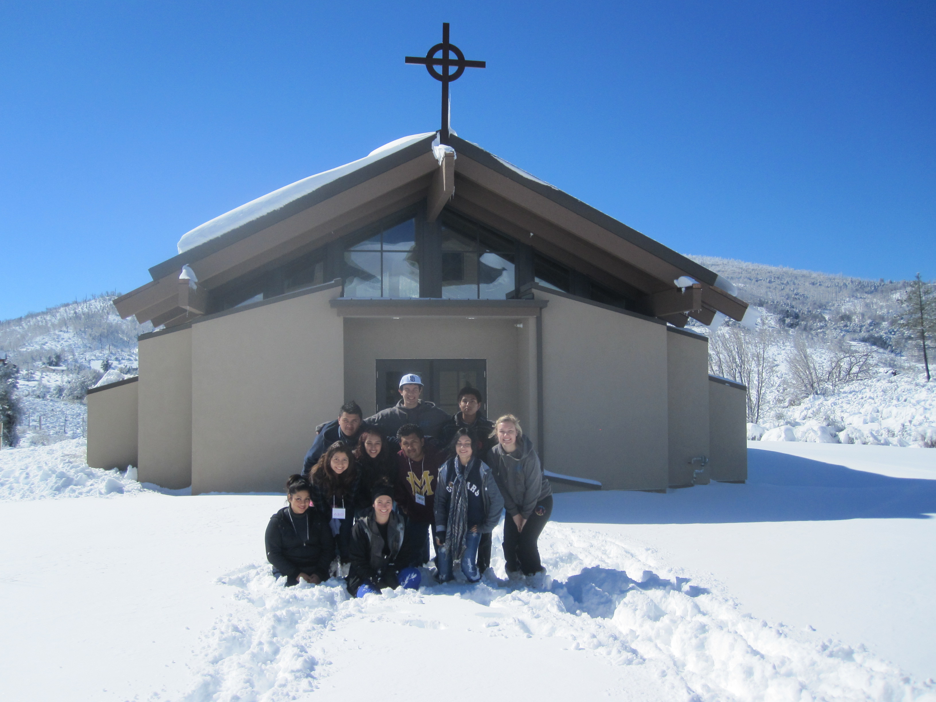 Teen group in snow in front of the Chapel