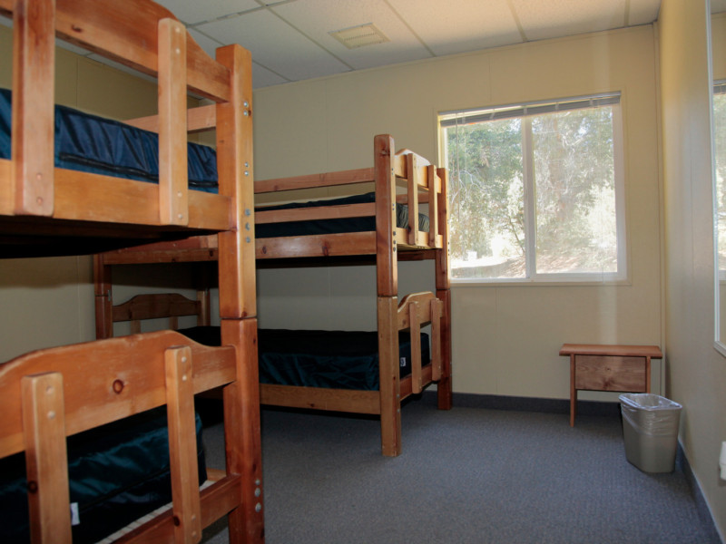 Dorm Village room with two bunkbeds and window