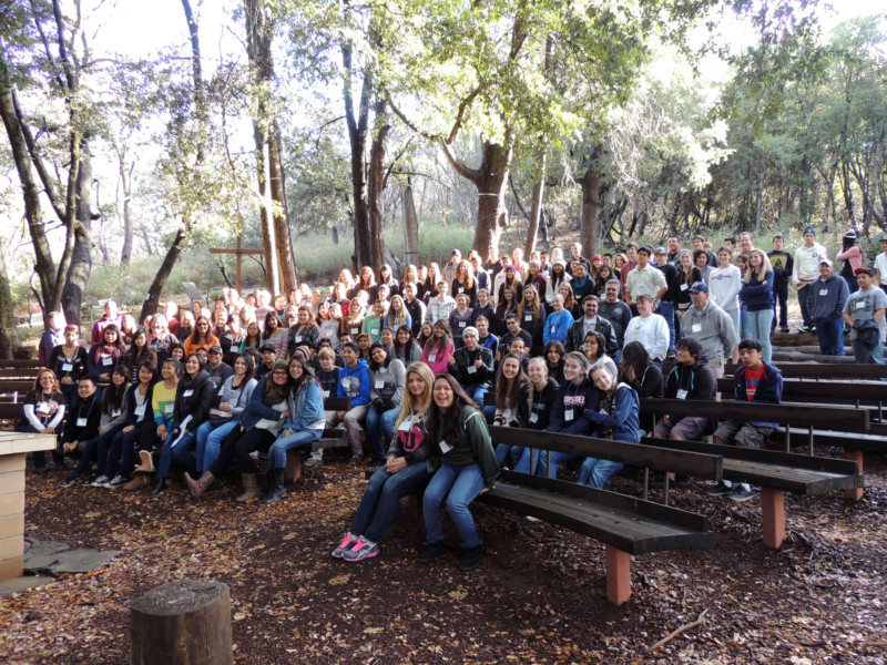 Confirmation Retreat group on benches in Mary's Grotto