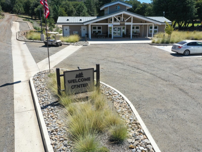 Welcome Center front entrance sign and parking lot