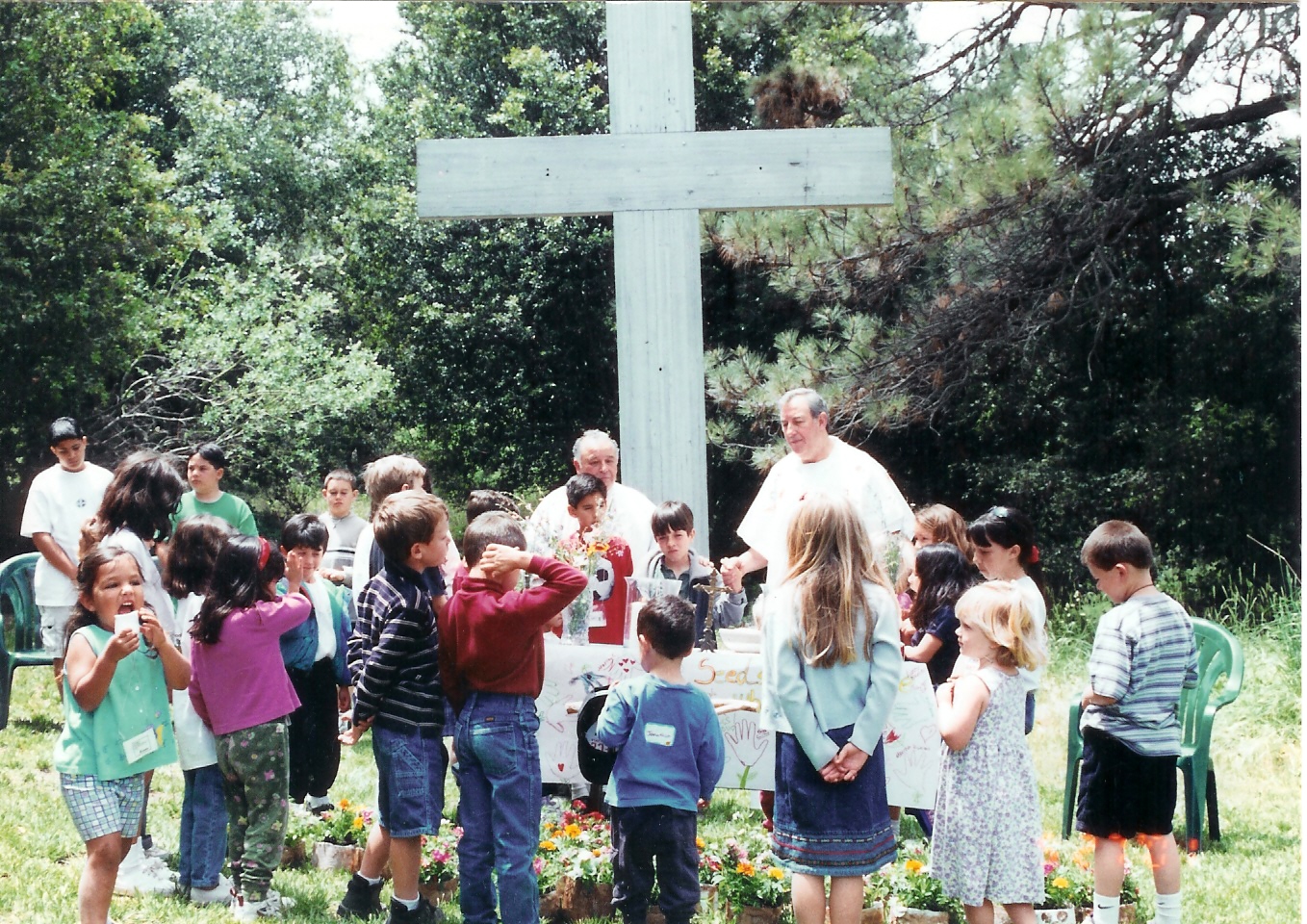 Family camp history Fr. Mark Campbell celebrating Mass with children