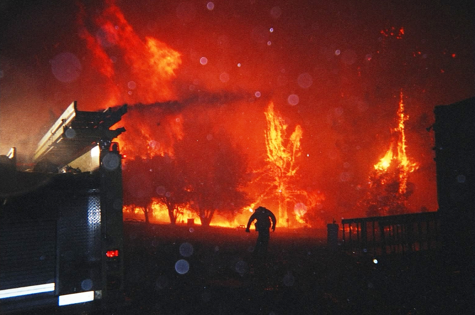 2003 Cedar Fire truck and firefighter on meadow