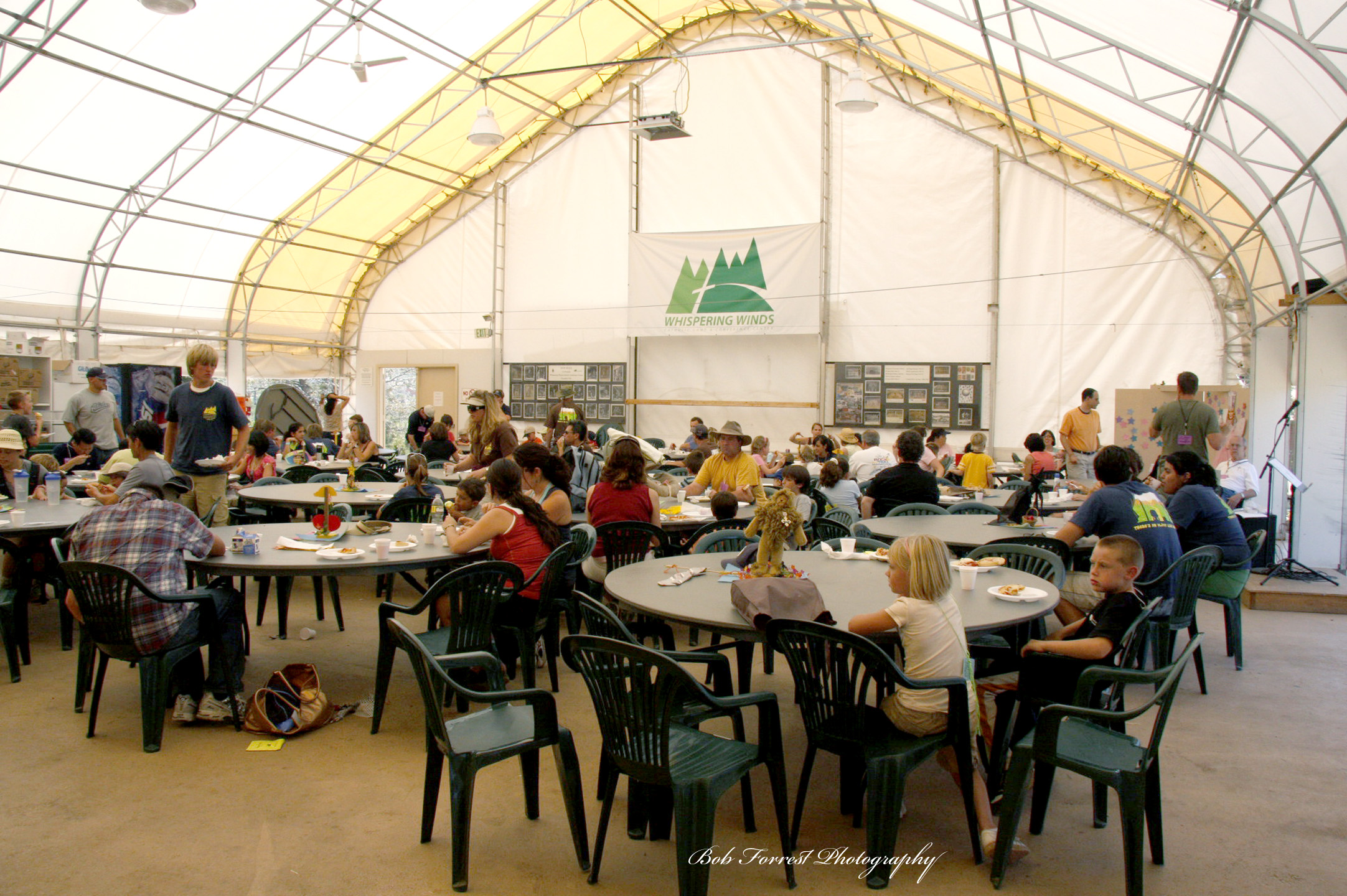 Old Dining Hall tent with diners