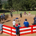 Children playing with ball in Gaga Pit