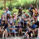 Families gathered in front of statue in Mary's Grotto