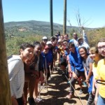 Teens on low ropes course team building activiy