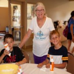 Woman volunteering with children's crafts